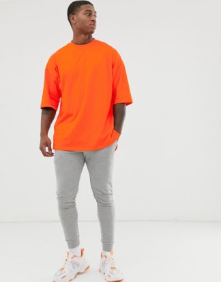 ASOS DESIGN - Orangefarbenes Oversize-T-Shirt mit Seitenschlitz